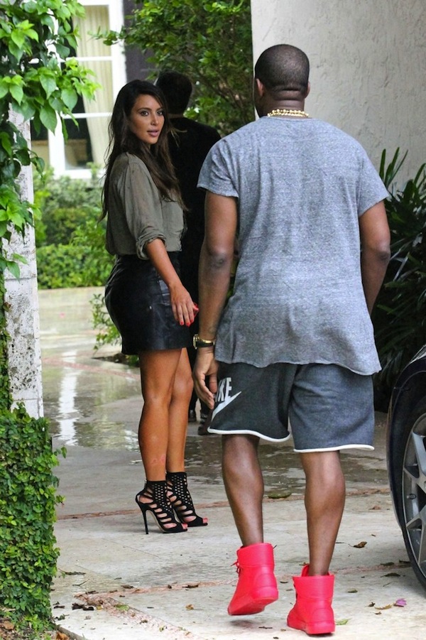 Kanye-West-Robert-Geller-tee-shirt-Nike-black-heather-sweat-shorts-Balenciaga-pleated-red-sneakers-upscalehype